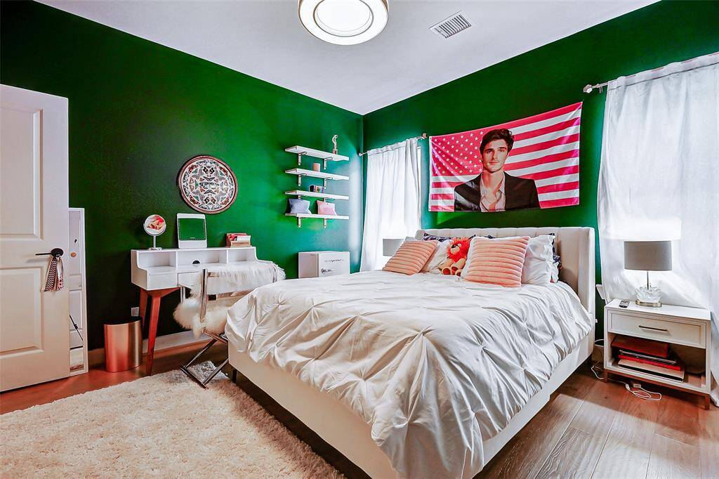 Generously sized secondary bedrooms offer comfort and style, with upgraded flooring and plenty of natural light.