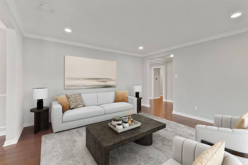 Another view of the formal living room. To the right is the front entrance. Flexible room: could make an ideal dining room or play room.