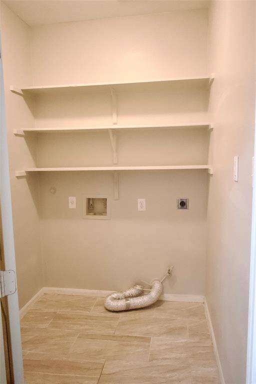 The utility room is conveniently located in the house.