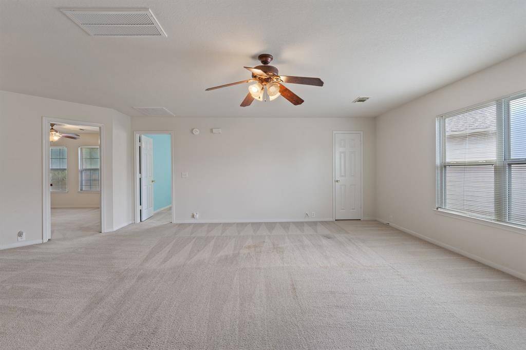 The flex space with a view of two of the bedrooms upstairs.
