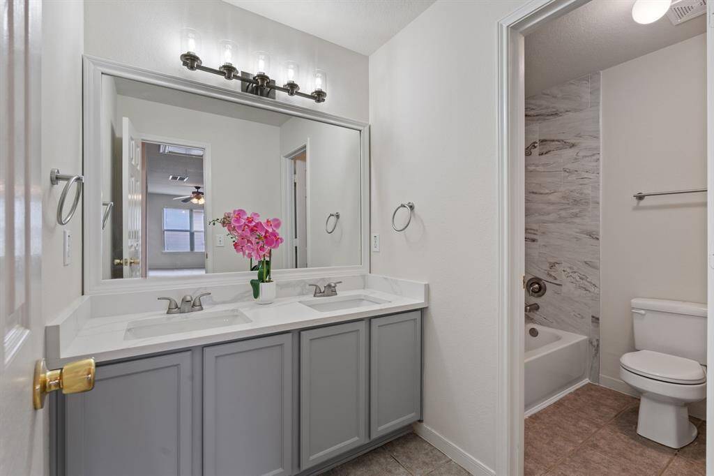 The fully updated bathroom with separate shower area upstairs.