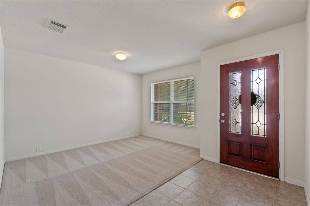 This space can be used for an office, flex space, formal dining, or converted into another bedroom.