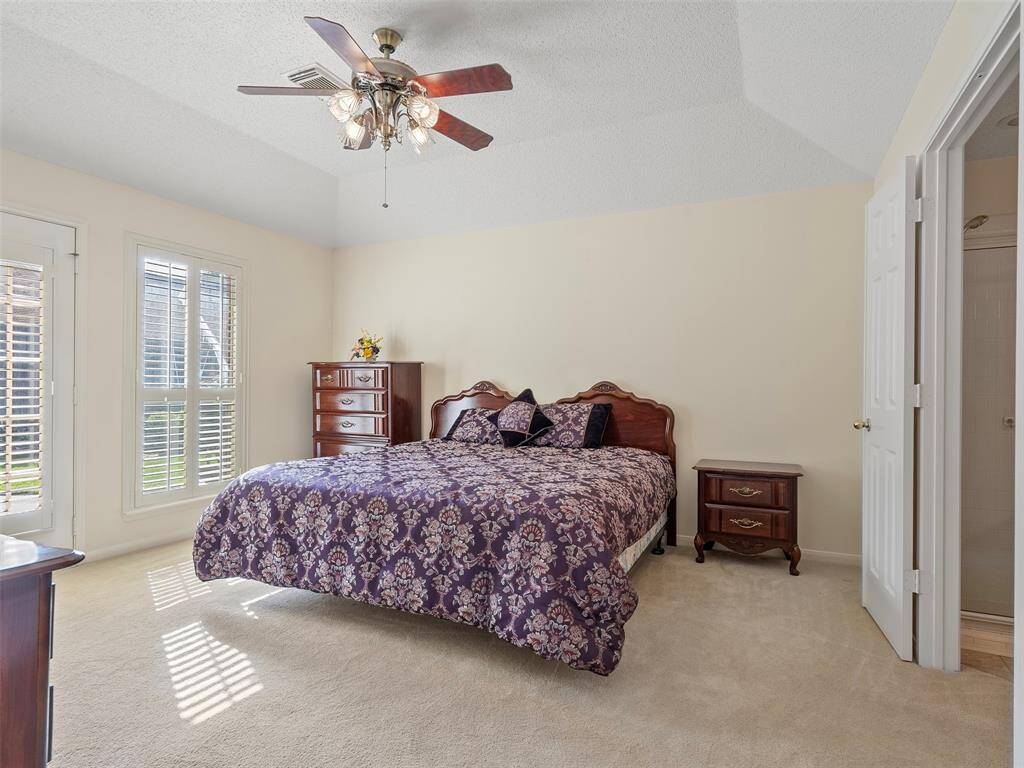 Primary Bedroom with a door to the backyard pool.