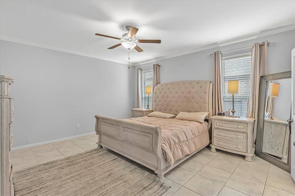 Spacious primary retreat with natural light and en-suit bath, located on the first floor.