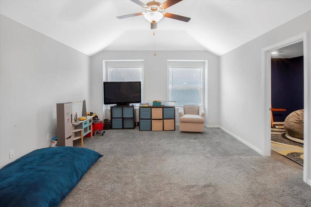 Spacious upstairs game room offers a verstatile second living area for play and relaxation.