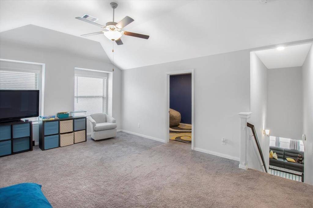 Spacious upstairs game room offers a verstatile second living area for play and relaxation.