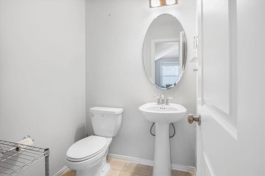 Chic upstairs powder Room with modern fixtures, great for guests.