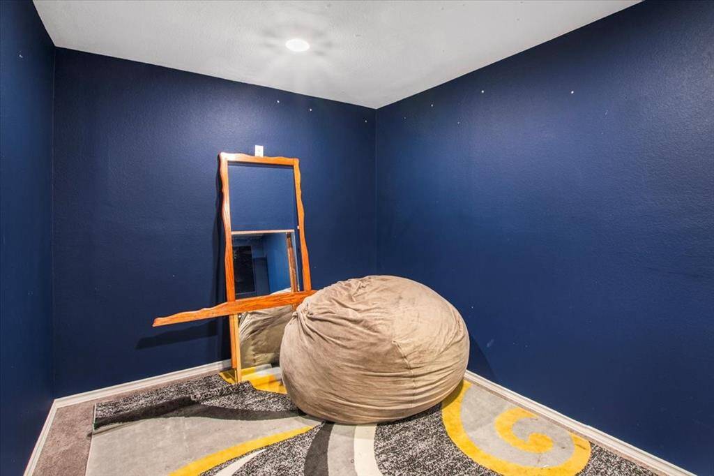 Cozy media room upstairs for movie nights and game days.