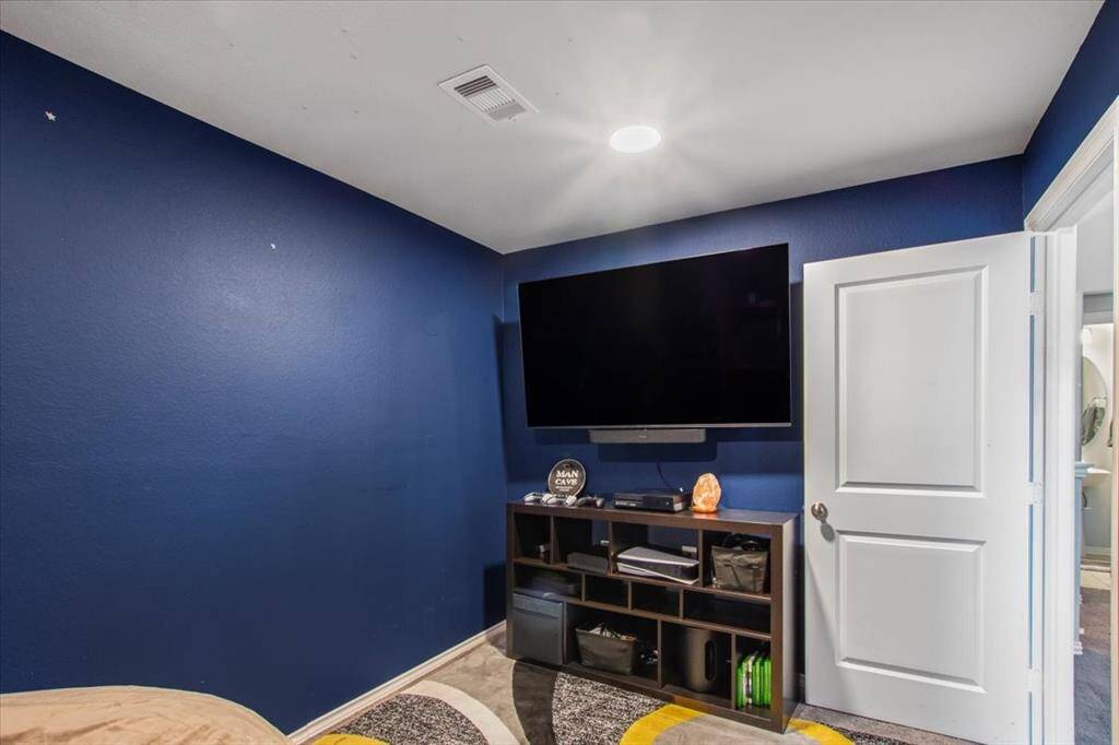 Cozy media room upstairs for movie nights and game days.
