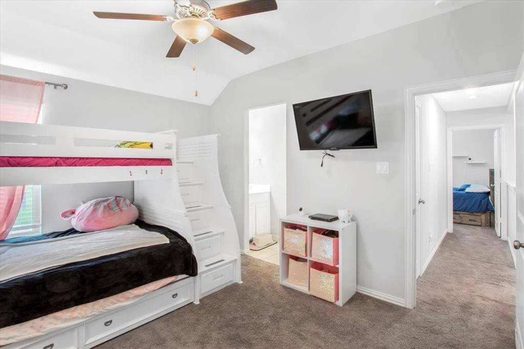 Spacious upstairs 4th bedroom with large window and walk in closet connected to Jack and Jill bathroom.