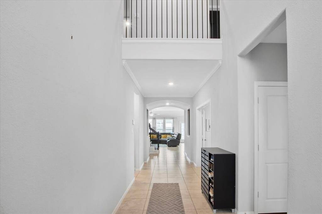 Welcoming entryway with soaring ceilings and elegant details