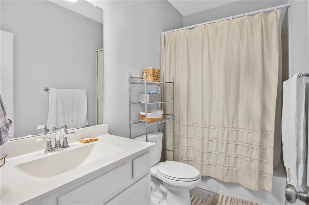 Stylish full bathroom conveniently on the first floor.