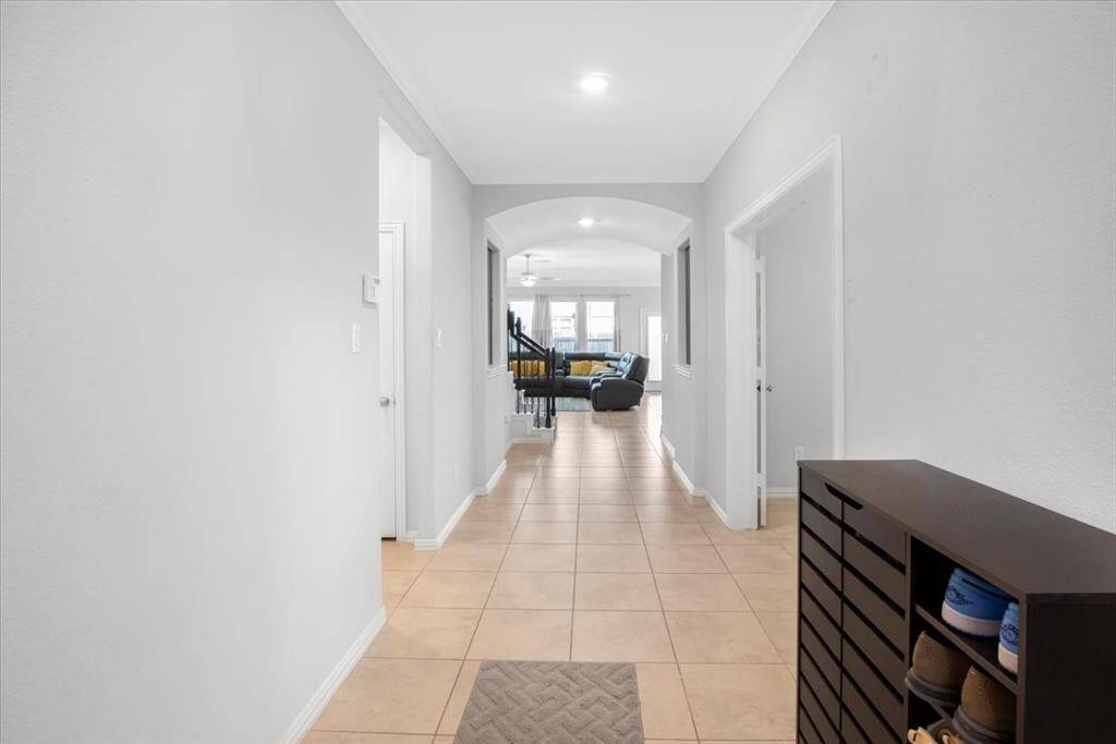 Welcoming entryway with soaring ceilings and elegant details