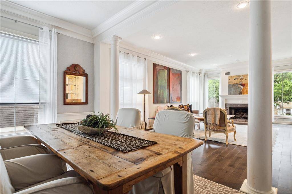 The dining room with built-in bookcases (out of view), opens to the living room, making it perfect for entertaining. After dinner family or guests can choose to retire to the comfortable seating in the living room to continue the evening.