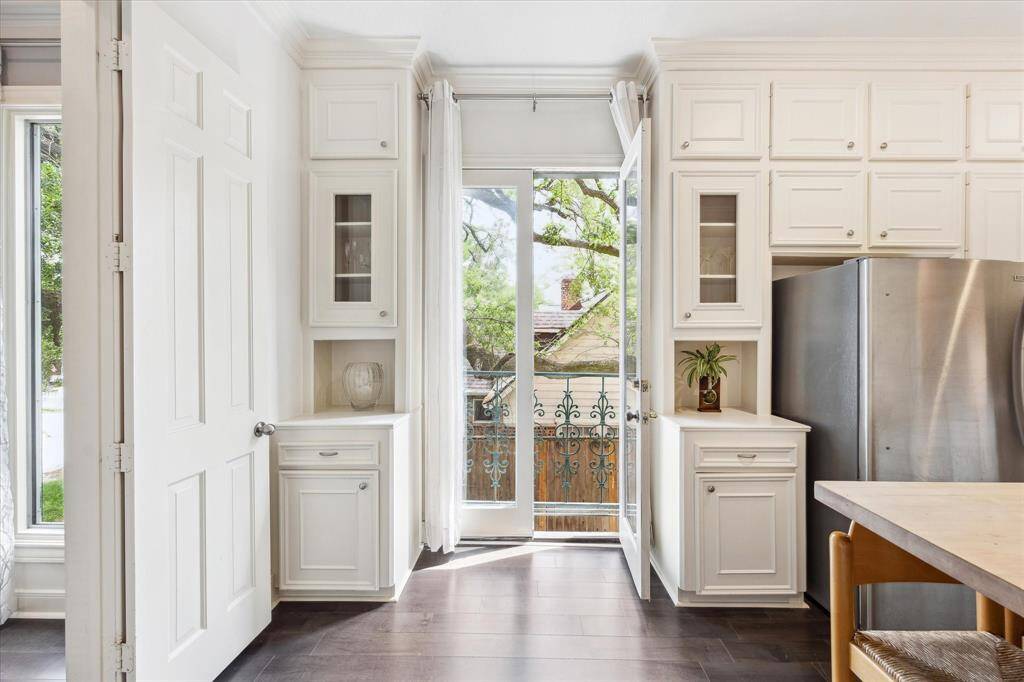 Open the French doors in the kitchen for a breath of fresh air and small balcony overlooking a signature oak tree. Great place for your herb garden.