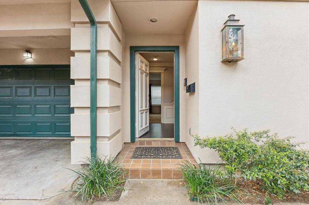 Welcome home! This New Orleans inspired architecture crafted by the legendary LUCIEN HOOD comes complete with a gas lantern at the entry and a wrought iron enclosed Juliet balcony on the 2nd floor.