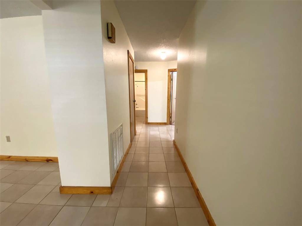 Hallway leading to the hall bath and bedrooms.