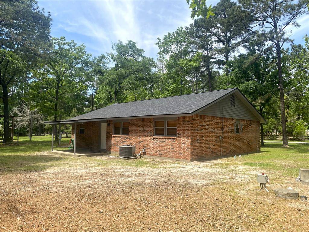 Back view of the home and it has a nice covered deck.