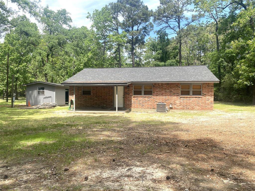 Another view of the back yard and back of the home.