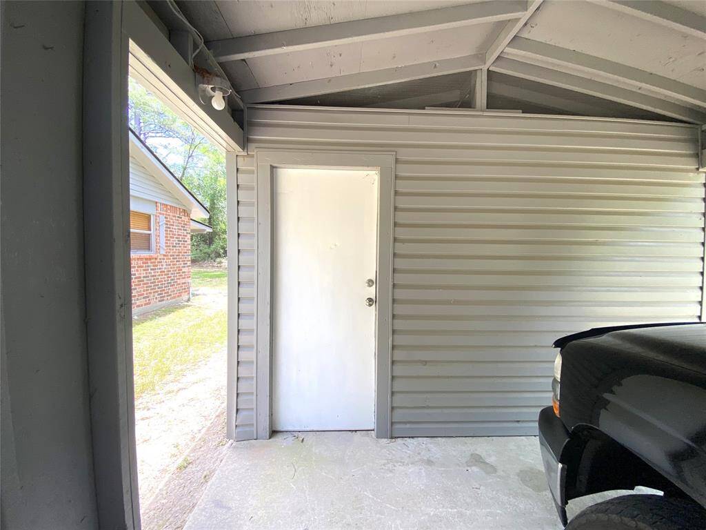Nice size storage area on the back of the carport.