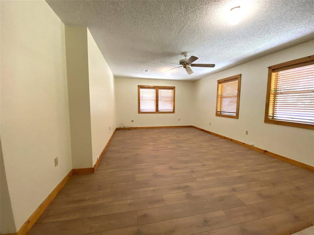 Living room has plenty of space for family and friends.