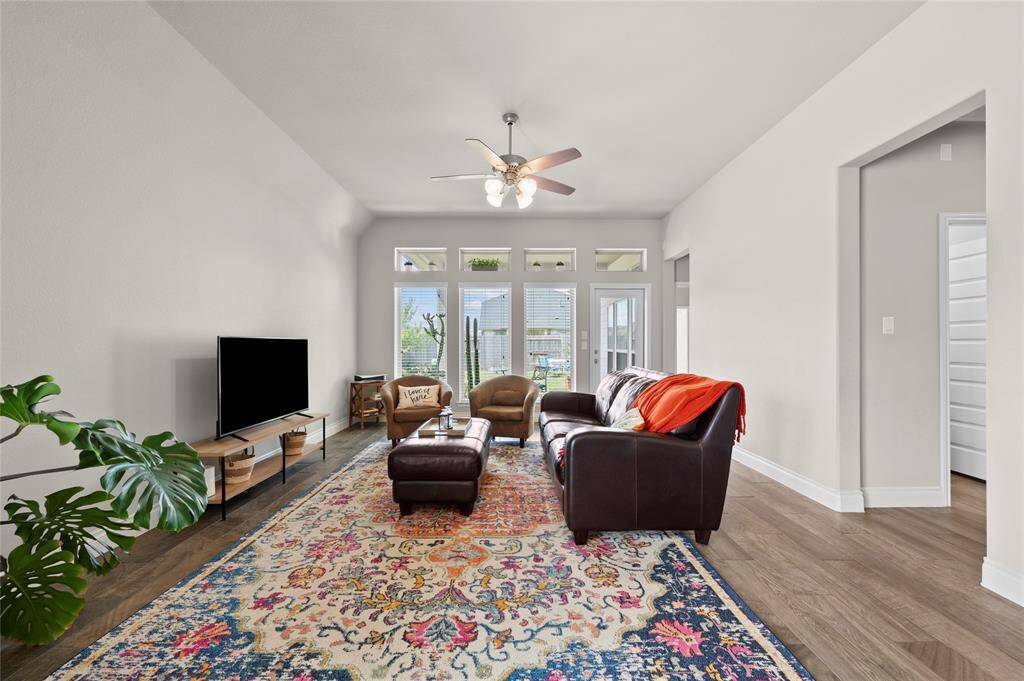 The living room offers tons of natural light and a great place to unwind and relax.