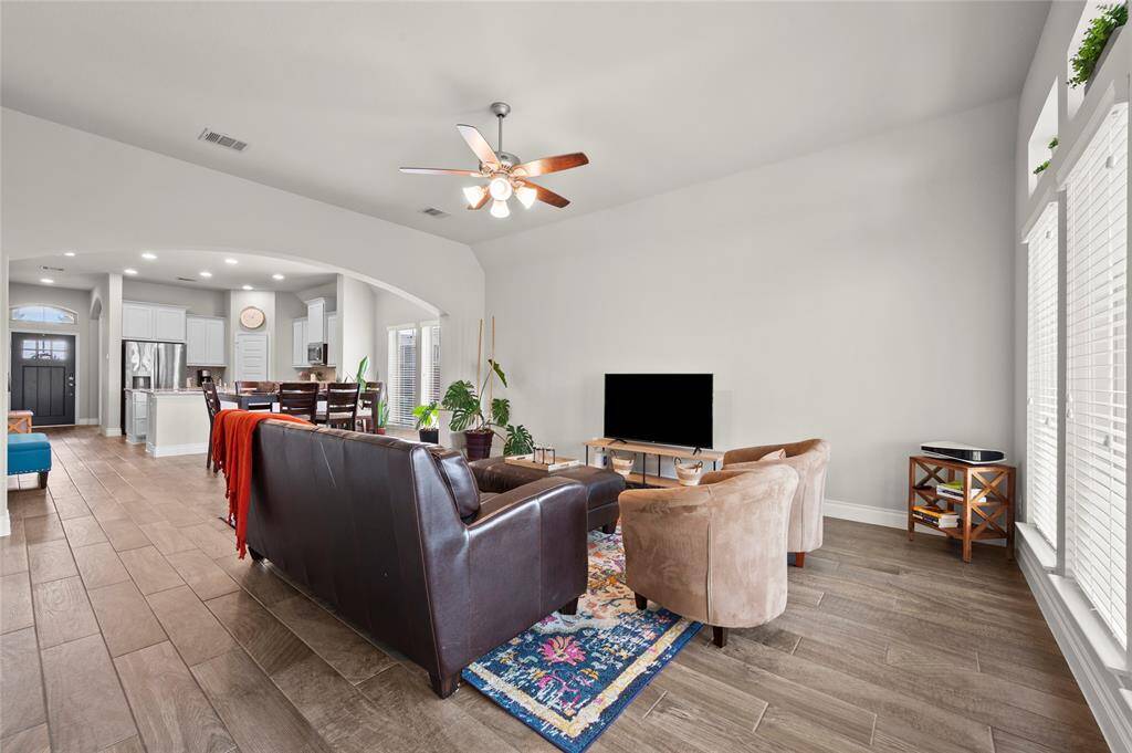 The spacious primary bedroom sits at the back of the house and offers plenty of natural light and privacy!