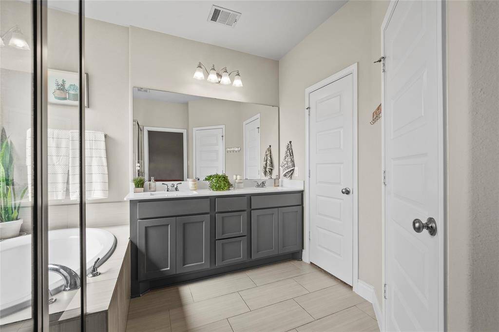 Enjoy having both a stand-up-shower and a large soaking tub in your primary bathroom!