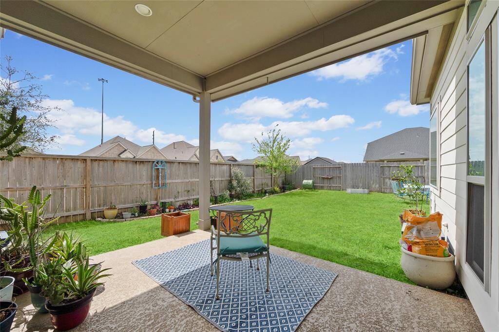 The large covered back patio is a great place to relax or entertain.