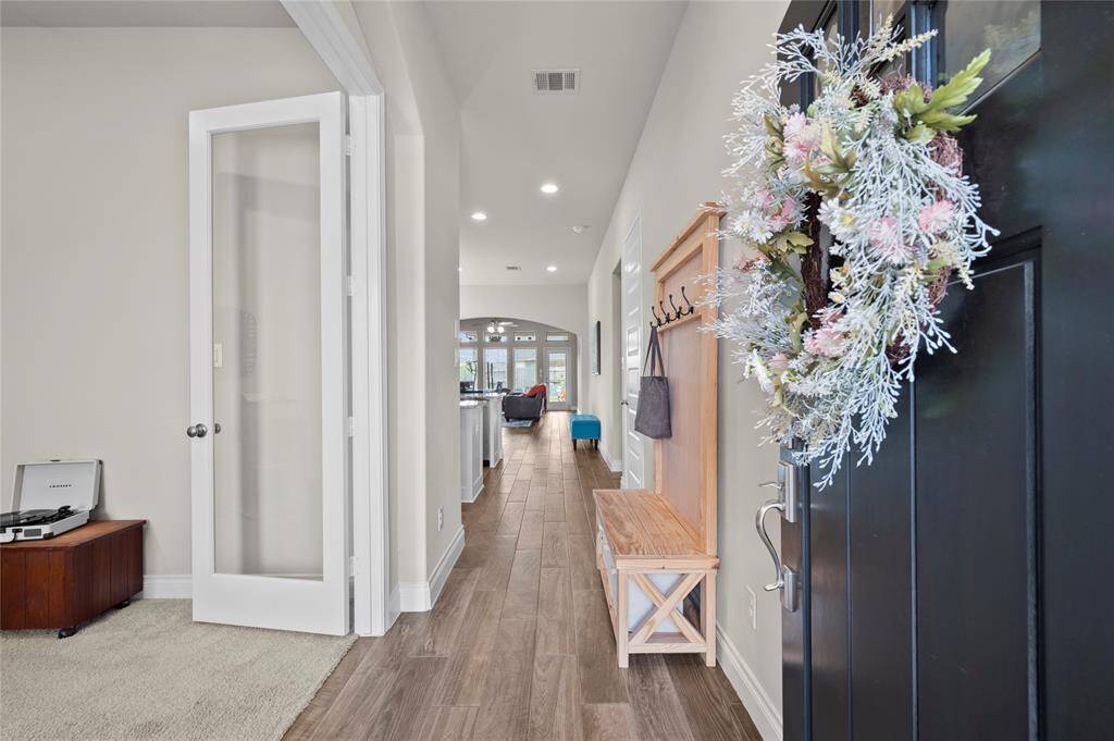 Upon entry, you'll notice an open-concept floor plan, tons of natural light, and wood-look tile flooring.