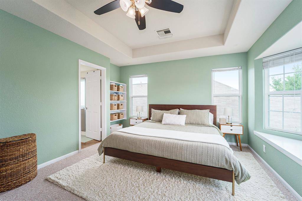 Large primary bedroom, heigh ceilings and window seat.