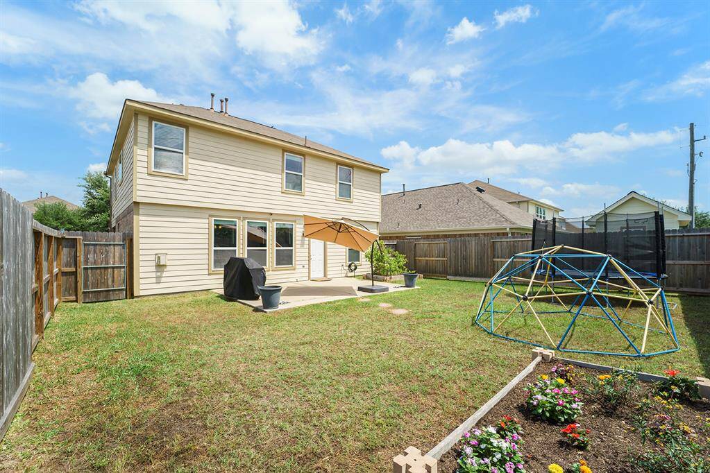 Good size back yard with flower beds.