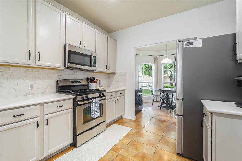 Beautiful kitchen with marble counter tops, SS Appliances, & 42" cabinets