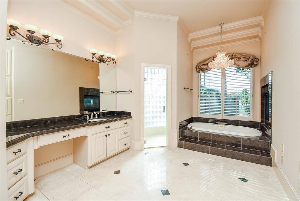 Garden tub and walk in shower in the Primary Bathroom