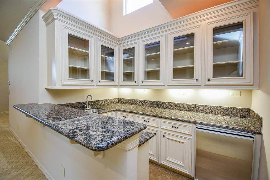 Look at the size of this "wet bar" in the upstairs game room area!