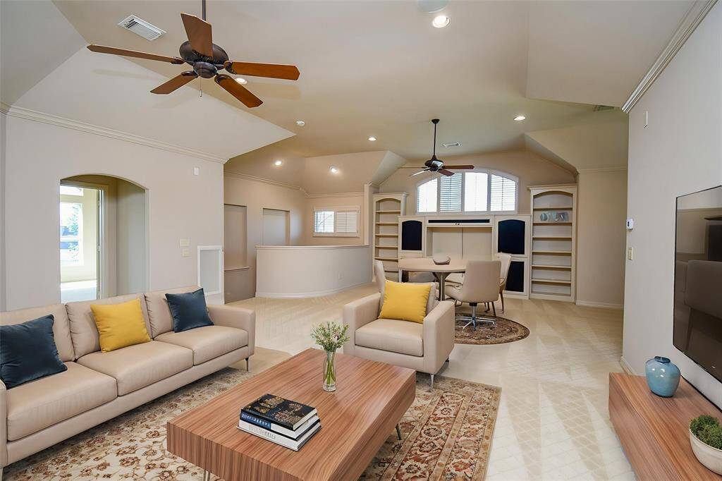Huge upstairs game room! Plenty of room for a pool table and many other entertainment products.  Large upstairs wet bar is just behind this picture.  (Virtually Staged)