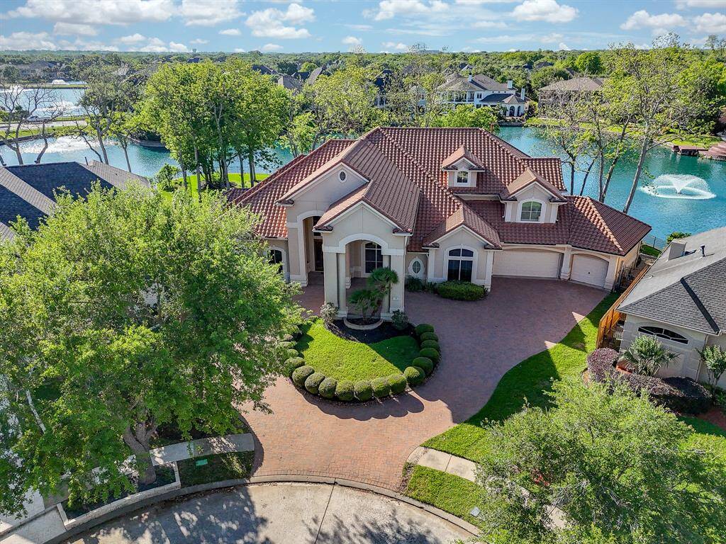 Shot of the front of the house with lake view in the back