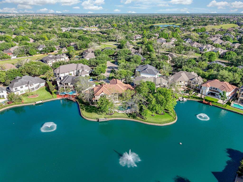 Gorgeous view of the lake.  Notice the HUGE double size lot with native trees.  Biggest lot on the water in this section!