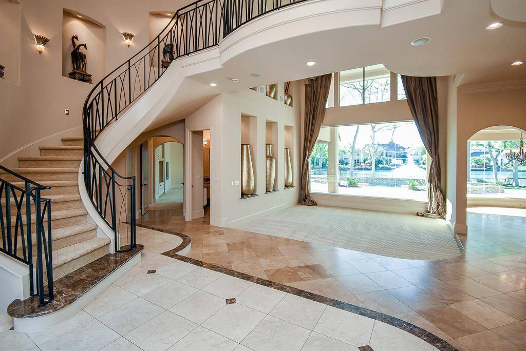 Incredible view once you enter through the front doors.  Open concept with stunning views of the pool and lake.