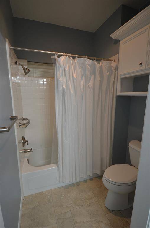 Front private bath with tub and custom overhead storage