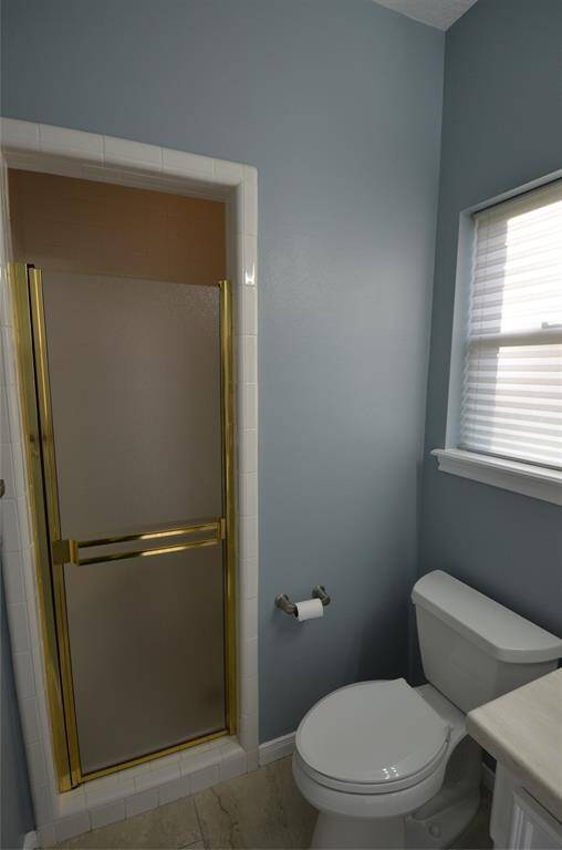 Bathroom from pool features full shower and access to kitchen area