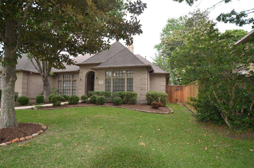 Backyard is also accessible from second locked gate and features cedar privacy fences