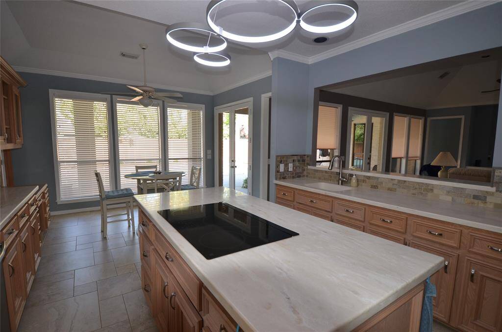 Breakfast nook features view of pool with second French doors leading to patio
