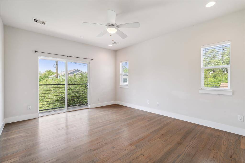 Your primary bedroom boasts tons of natural light, with large sliding doors to your own Juliet balcony.