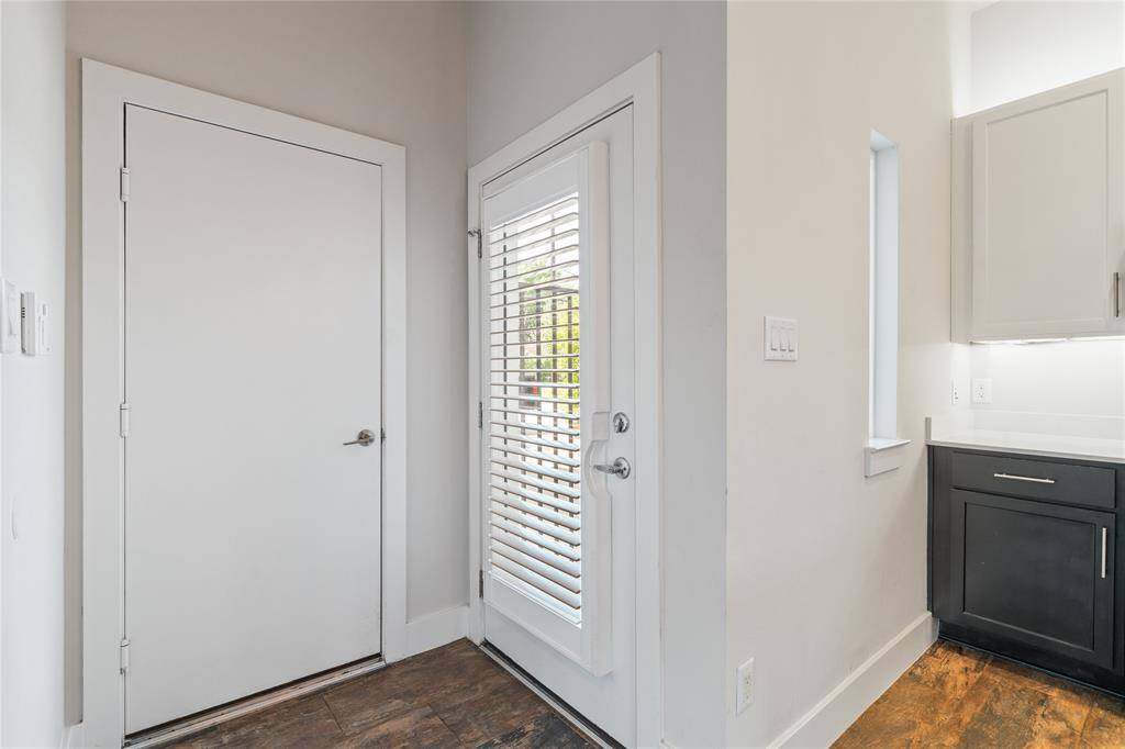 Wood tile flooring throughout the entire 1st floor, a renovated kitchen that opens up to your dining and living room .