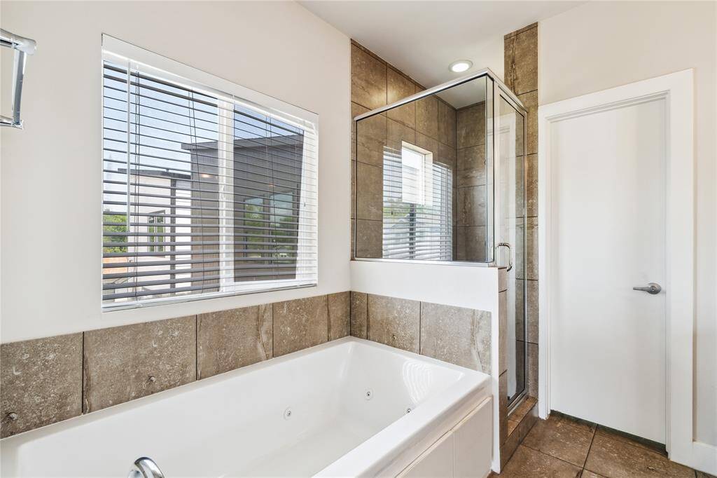 Your own jetted tub and walk in shower, perfect for winding down after a long day of work.