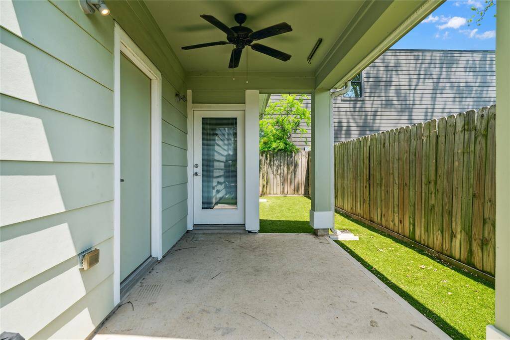 Your covered patio with a ceiling fan and plenty of shade, perfect for outdoor relaxation.