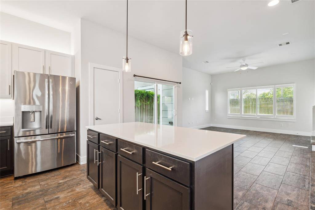 Your private access right off of the kitchen to your covered patio and turfed backyard.