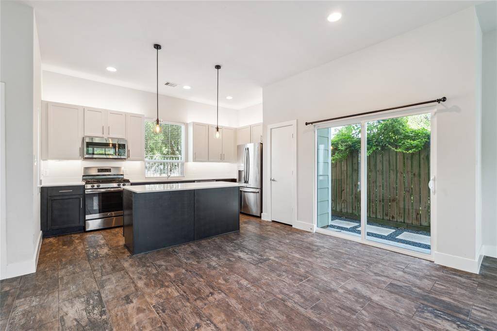 Your dining room that opens up into your living room area, with views of your turfed backyard with large pavers...great for outdoor grilling and entertaining.