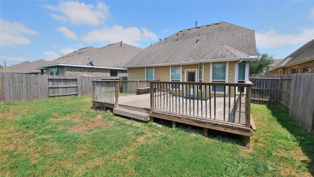 Another view of the backyard with patio